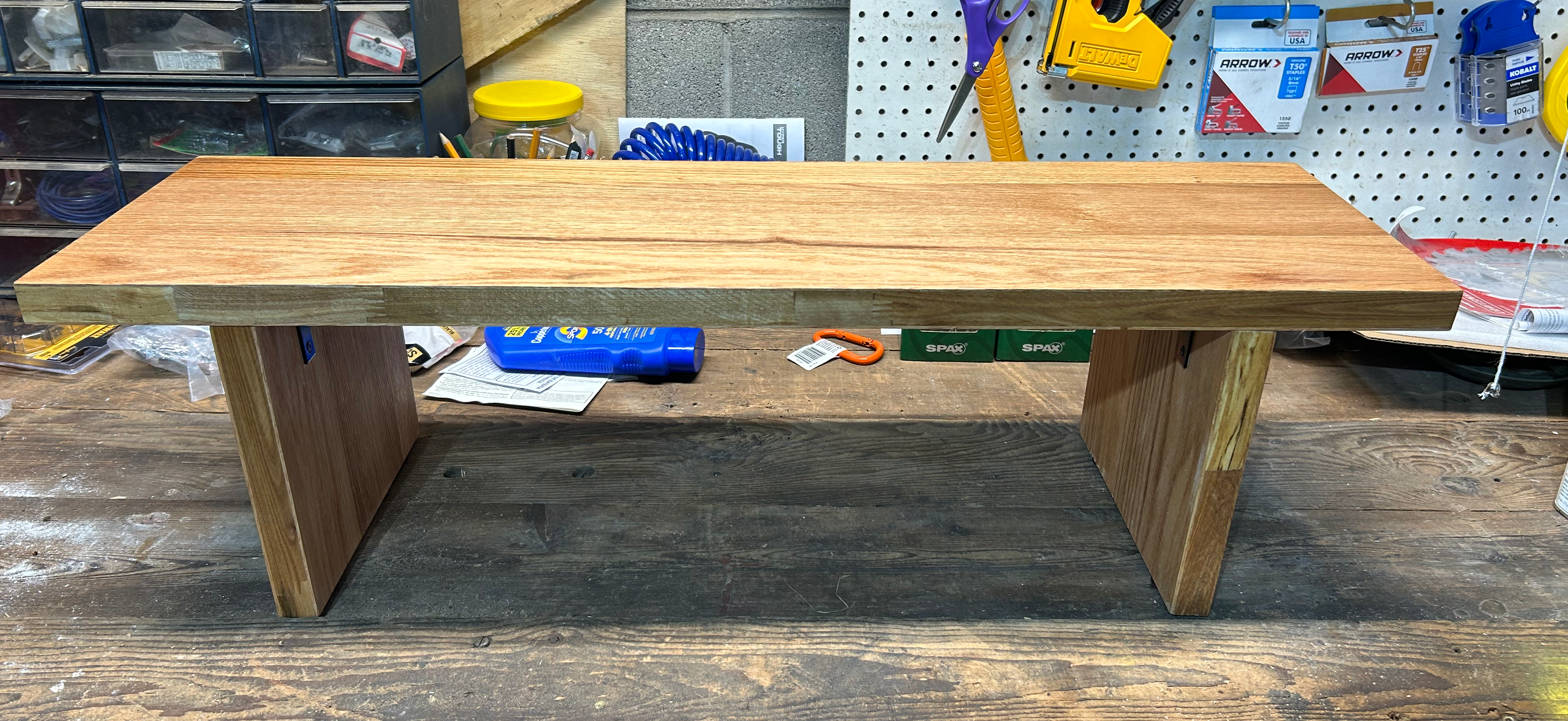 Finished shelf sitting on a work bench.